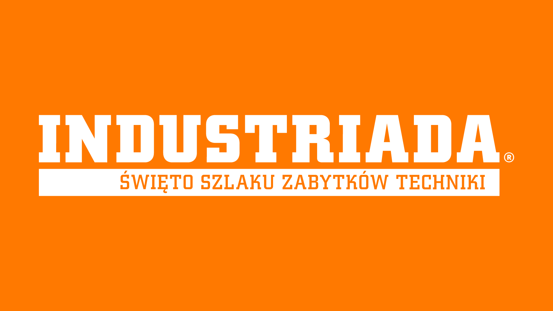 Pomarańczowa grafika z białym logo Industriady - Szlaku Zabytków Techniki